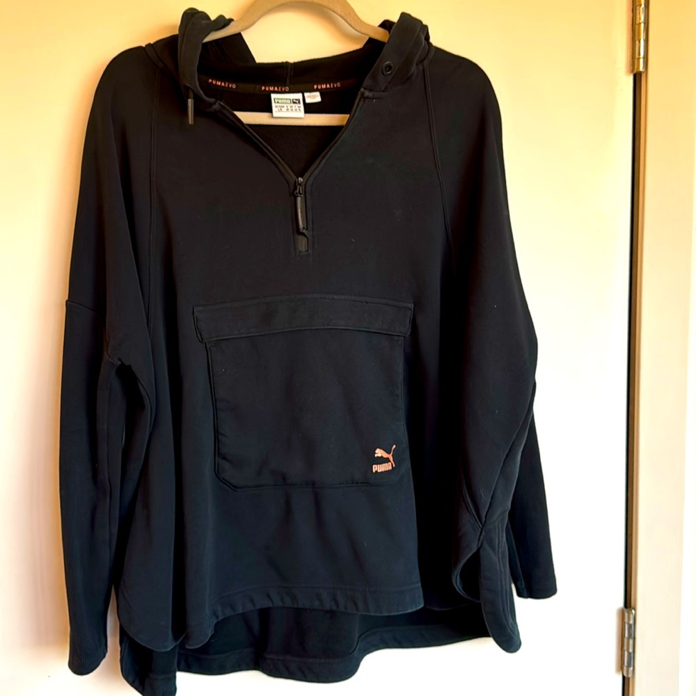 Cape style sweatshirt, jacket with batwing sleeves, and a kangaroo pocket
